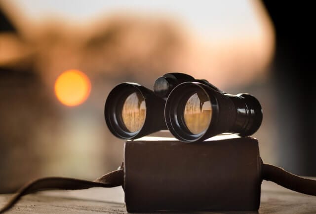 Binoculars on a book